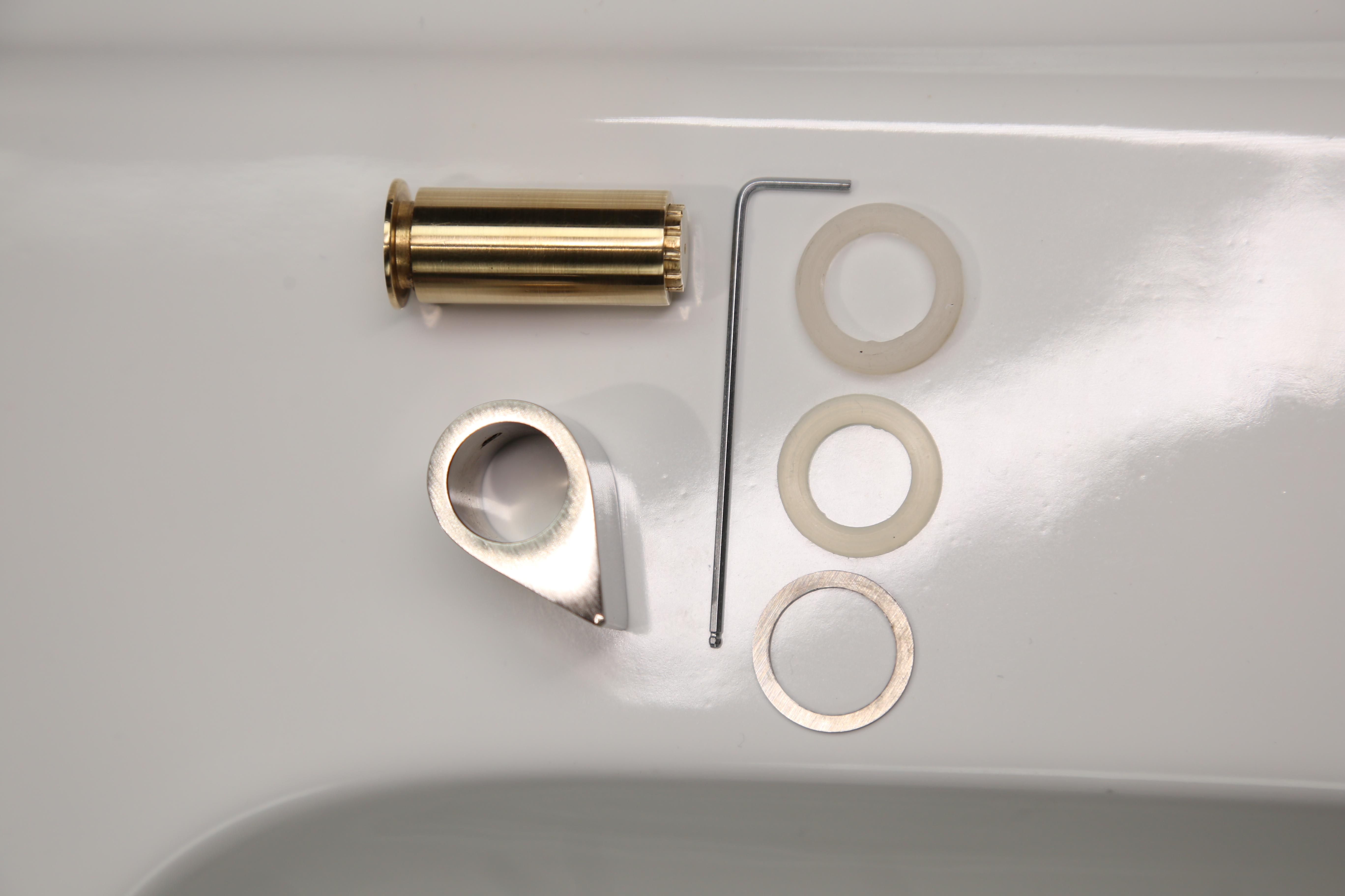 Aabshar water-saving nozzle components arranged for a product photograph